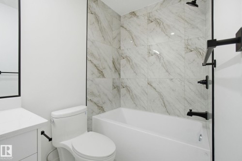 Bathroom featuring vanity and shower / bathtub combination - 2408 208 Street, Edmonton, AB - Indoor Photo Showing Bathroom