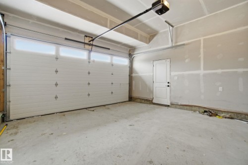 Garage with a garage door opener - 2408 208 Street, Edmonton, AB - Indoor Photo Showing Garage