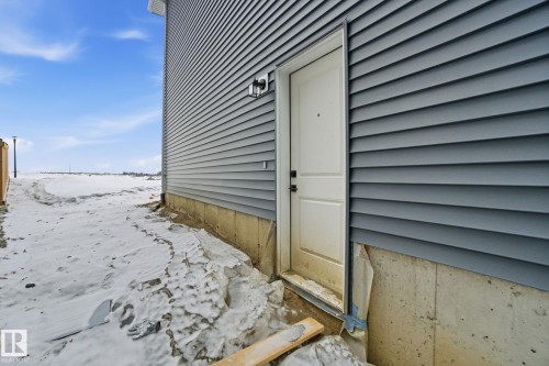 View of snow covered property entrance - 2408 208 Street, Edmonton, AB - Outdoor