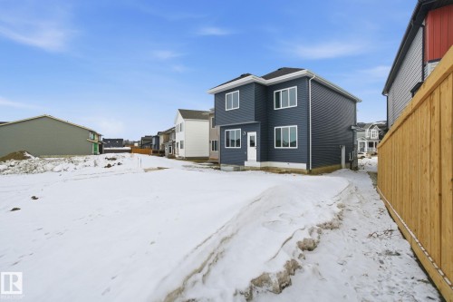 Snow covered property with a residential view - 2408 208 Street, Edmonton, AB - Outdoor