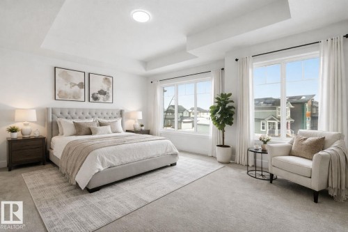 Carpeted bedroom with a raised ceiling - 2408 208 Street, Edmonton, AB - Indoor Photo Showing Bedroom