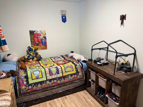 Bedroom featuring wood finished floors - 4506 53 Avenue, Barrhead, AB - Indoor Photo Showing Bedroom