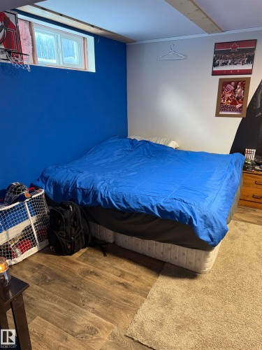 Bedroom featuring wood finished floors - 4506 53 Avenue, Barrhead, AB - Indoor Photo Showing Bedroom