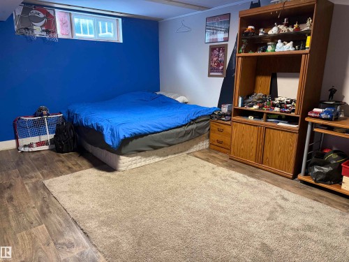 Bedroom featuring wood finished floors - 4506 53 Avenue, Barrhead, AB - Indoor Photo Showing Bedroom