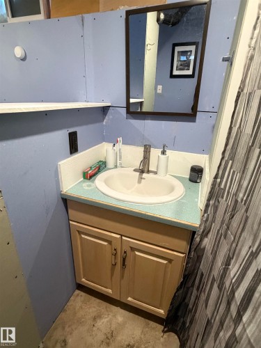 Bathroom featuring vanity and concrete flooring - 4506 53 Avenue, Barrhead, AB - Indoor Photo Showing Bathroom