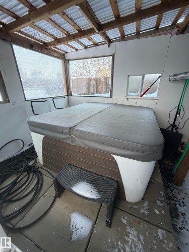 View of patio / terrace featuring a hot tub - 4506 53 Avenue, Barrhead, AB - Indoor