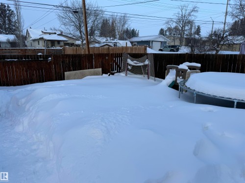 View of fenced backyard - 4506 53 Avenue, Barrhead, AB - Outdoor