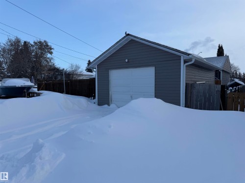 View of snow covered garage - 4506 53 Avenue, Barrhead, AB - Outdoor With Exterior