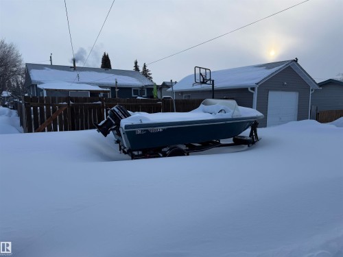 Yard covered in snow with an outdoor structure - 4506 53 Avenue, Barrhead, AB - Outdoor