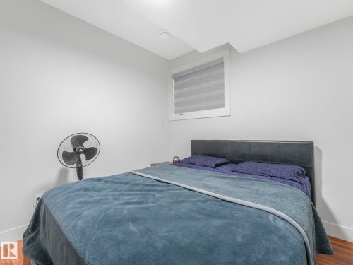 Bedroom featuring wood finished floors and baseboards - 120 38 Street, Edmonton, AB - Indoor Photo Showing Bedroom