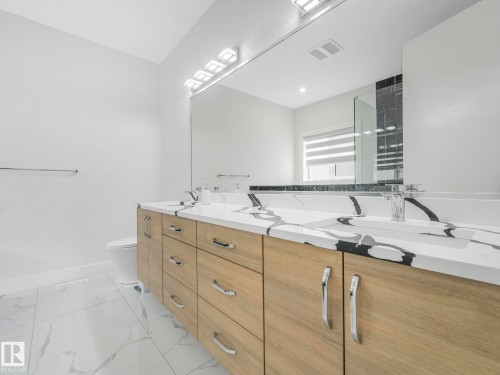 Bathroom with double vanity and a shower - 120 38 Street, Edmonton, AB - Indoor Photo Showing Bathroom