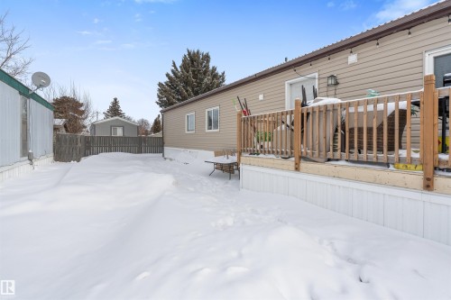 Yard layered in snow with a deck - 56 Westview Boulevard Boulevard, Edmonton, AB - Outdoor With Exterior