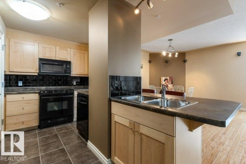 308 9020 Jasper Avenue, Edmonton, AB - Indoor Photo Showing Kitchen With Double Sink