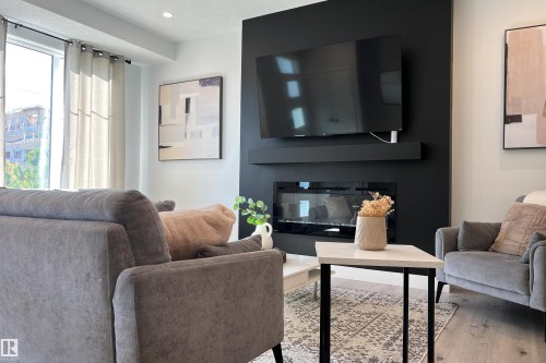 8040 Kiriak Link, Edmonton, AB - Indoor Photo Showing Living Room With Fireplace