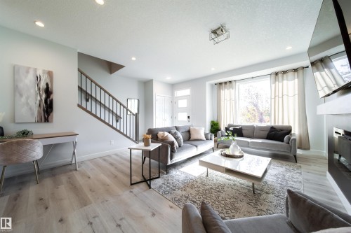 8040 Kiriak Link, Edmonton, AB - Indoor Photo Showing Living Room With Fireplace