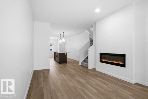 8636 Edgemont Link, Edmonton, AB - Indoor Photo Showing Living Room With Fireplace