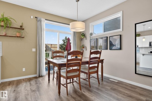Dining room with light wood-type flooring - 211 Sturtz Bend, Leduc, AB - Indoor Photo Showing Dining Room