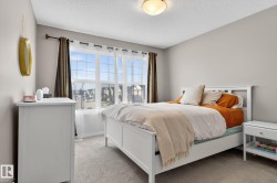 Bedroom with carpet and a textured ceiling - 