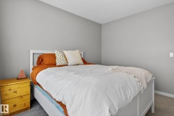 Bedroom with carpet and a textured ceiling - 