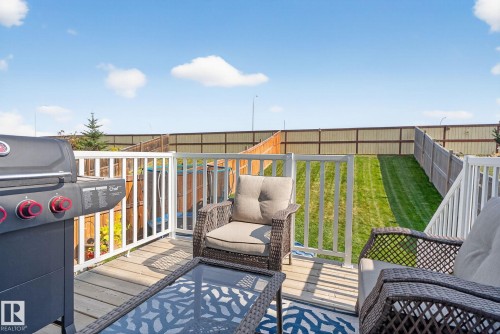 Deck with area for grilling and a lawn - 211 Sturtz Bend, Leduc, AB - Outdoor With Deck Patio Veranda With Exterior