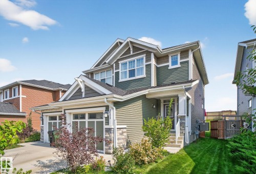 Craftsman house with stone siding and an attached garage - 211 Sturtz Bend, Leduc, AB - Outdoor