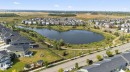 Aerial view of property and surrounding area with nearby suburban area and a nearby body of water - 211 Sturtz Bend, Leduc, AB  - Outdoor With View 