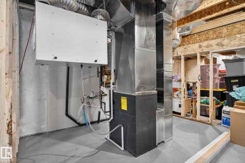 Utility room featuring heating unit - 211 Sturtz Bend, Leduc, AB - Indoor Photo Showing Basement