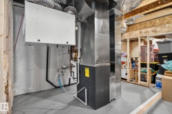 Utility room featuring heating unit - 