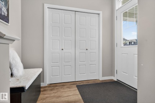 Foyer entrance featuring light wood-style flooring and baseboards - 211 Sturtz Bend, Leduc, AB - Indoor
