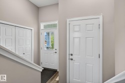 Foyer entrance featuring dark wood-style flooring - 