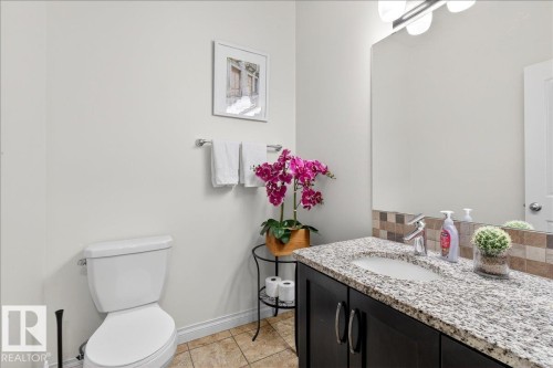 Bathroom with vanity and light tile patterned floors - 12761 119 St, Edmonton, AB - Indoor Photo Showing Bathroom