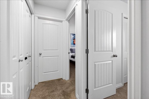 Corridor with carpet flooring - 12761 119 St, Edmonton, AB - Indoor Photo Showing Other Room