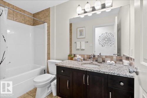 Bathroom featuring vanity and shower / tub combo - 12761 119 St, Edmonton, AB - Indoor Photo Showing Bathroom