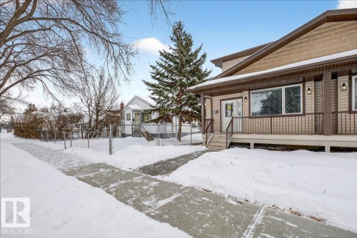 View of snow covered exterior with a residential view - 12761 119 St, Edmonton, AB - Outdoor