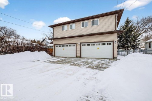 View of snow covered exterior with a garage - 12761 119 St, Edmonton, AB - Outdoor