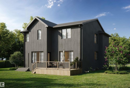 Rear view of property with a yard and a wooden deck - 9243 148 Street, Edmonton, AB - Outdoor