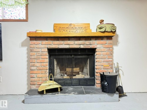 1 Bamber Place, Leduc, AB - Indoor Photo Showing Living Room With Fireplace