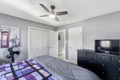 Bedroom with a ceiling fan and a closet - 3908 161 Avenue Nw, Edmonton, AB - Indoor Photo Showing Bedroom