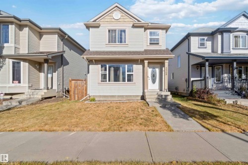View of front of home with a front yard and a shingled roof - 3908 161 Avenue Nw, Edmonton, AB - Outdoor With Facade