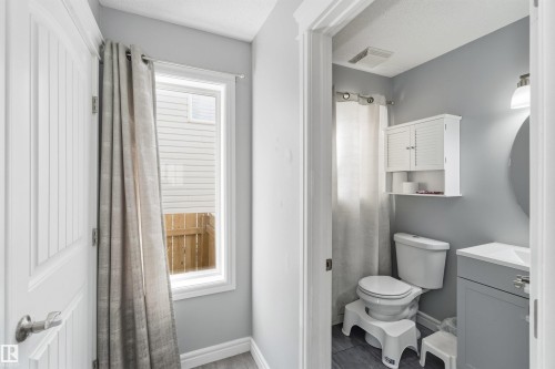 Half bathroom featuring vanity and a textured ceiling - 3908 161 Avenue Nw, Edmonton, AB - Indoor Photo Showing Bathroom