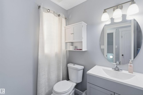 Full bath featuring vanity and curtained shower - 3908 161 Avenue Nw, Edmonton, AB - Indoor Photo Showing Bathroom