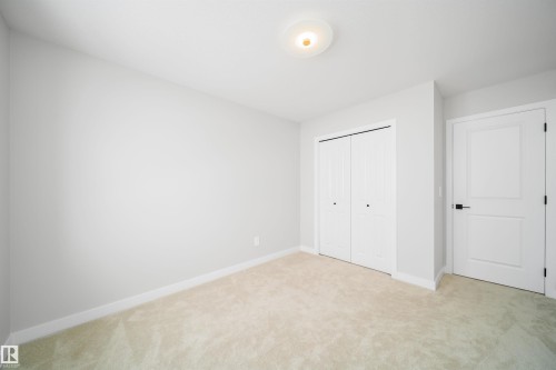Unfurnished bedroom featuring a closet and light carpet - 15 Chambery Crescent, St. Albert, AB - Indoor Photo Showing Other Room