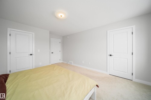Bedroom featuring baseboards and light colored carpet - 15 Chambery Crescent, St. Albert, AB - Indoor Photo Showing Other Room