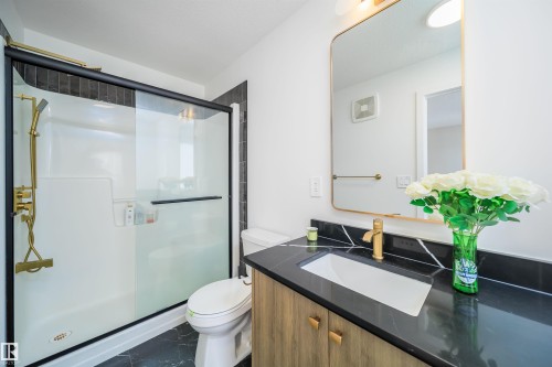 Bathroom featuring vanity, a stall shower, and dark marble finish floors - 15 Chambery Crescent, St. Albert, AB - Indoor Photo Showing Bathroom