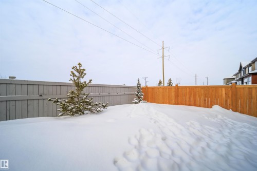 Snowy yard featuring a fenced backyard - 15 Chambery Crescent, St. Albert, AB - Outdoor