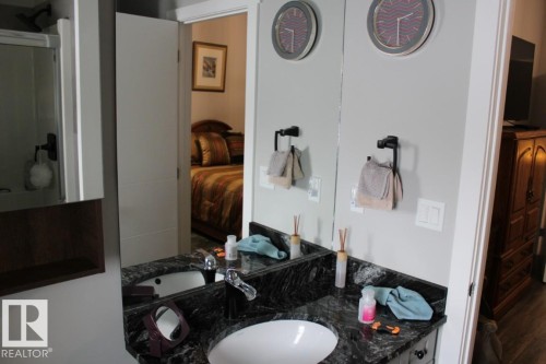 Bathroom featuring vanity, connected bathroom, and a shower stall - 22 6519 46 Street, Wetaskiwin, AB - Indoor Photo Showing Bathroom