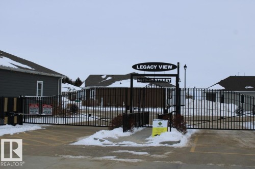 View of snow covered gate - 22 6519 46 Street, Wetaskiwin, AB - Outdoor