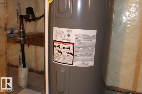 Utility room with water heater - 22 6519 46 Street, Wetaskiwin, AB - Indoor Photo Showing Basement