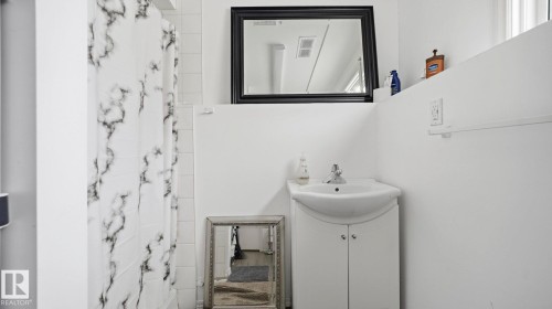 Bathroom featuring vanity and a shower with curtain - 4502 50A Avenue, Beaumont, AB - Indoor Photo Showing Bathroom