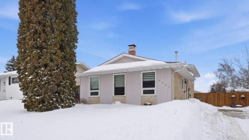 View of front of property with a chimney - 4502 50A Avenue, Beaumont, AB - Outdoor